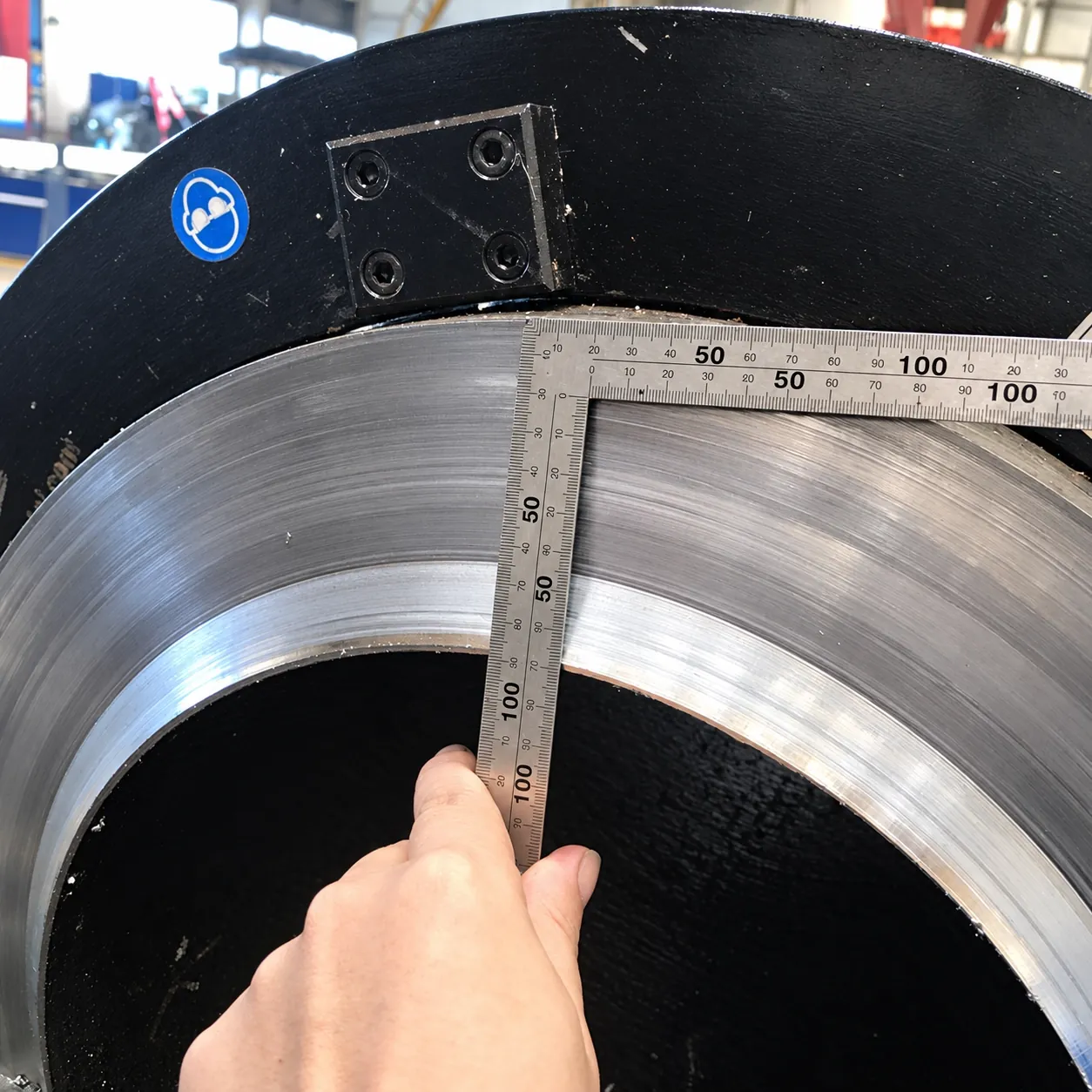 Machined pipe end face checked with a steel square after bevelling with the SOC