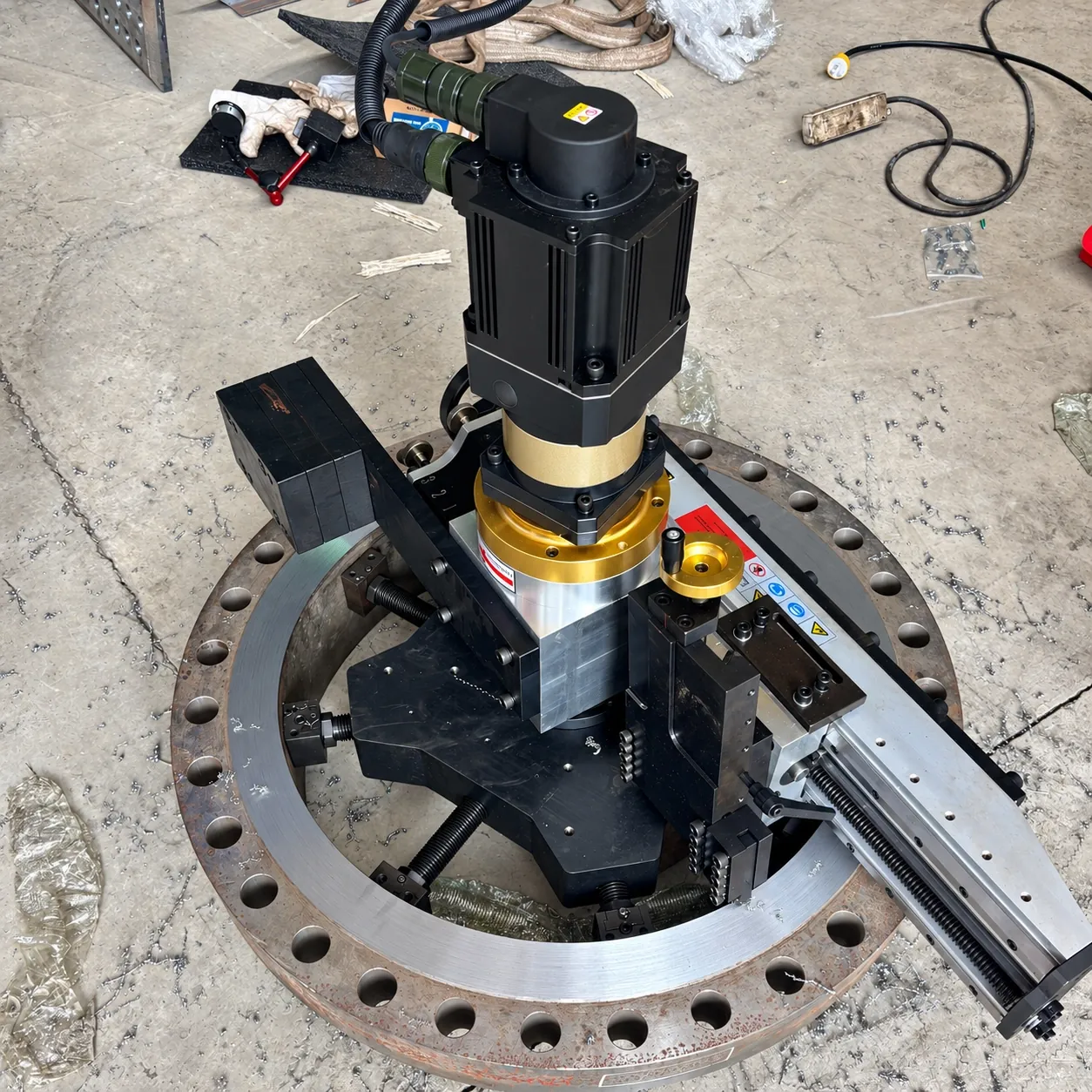 Servo-driven portable flange facer machining a bolted flange in the workshop